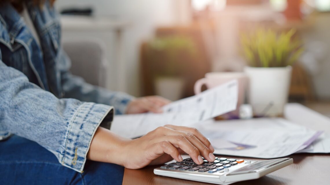 Closeup of woman budgeting